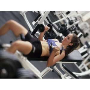 Young Woman Working Out with Hand Wieghts, Rutland, Vermont, USA 