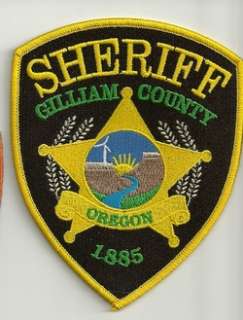 NEW STYLE GILLIAM COUNTY SHERIFF, OREGON WIND TURBINE/RIVER  
