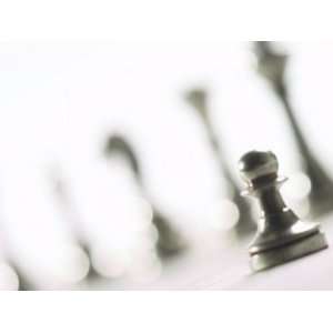  Focus of Silver Pawn on Chess Board with Blurred Chess Pieces 