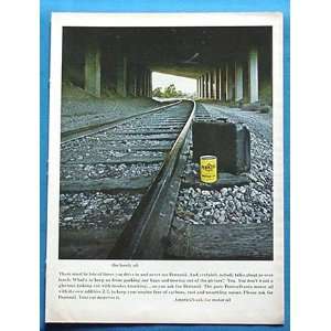   Lonely Oil Can Suitcase on RR Tracks Print Ad (75)