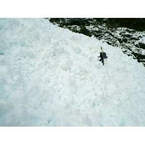  A Mountain Climber Crosses Through Avalanche Debris on Way 