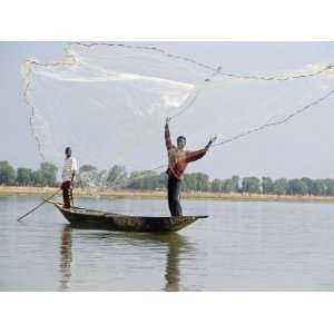 Fisherman Cast Hand Nets on the River Niger from Shallow Draught Boats 