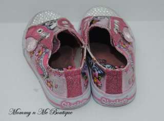   your consideration is a girls Skechers twinkle toes shoes in size 12