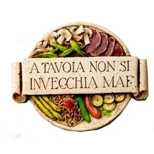   plaque with the words A tavola Non Si Invecchia Mai