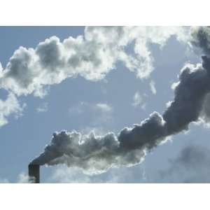  Industrial Smokestack Emitting Smoke into Cloudy Blue Sky 