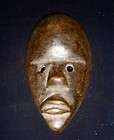 African tribal passport mask used for identifica​tion, D