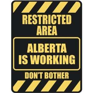   RESTRICTED AREA ALBERTA IS WORKING  PARKING SIGN