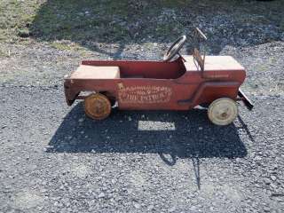 HERE IS A VINTAGE PEDAL CAR MADE BY HAMILTON. IT IS A JEEP FIRE TRUCK 