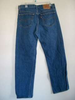 Levis 501 button fly, straight leg class jeans. Medium blue color.