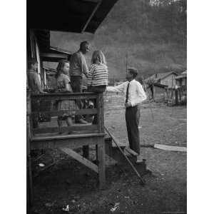 Senator John F. Kennedy Greeting Rural Family While Campaigning For 
