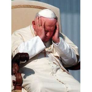 Pope John Paul II Holds His Head During the Weekly Open Air General 