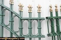 Seven arched sections of wrought iron fence plus 9 mounting posts 