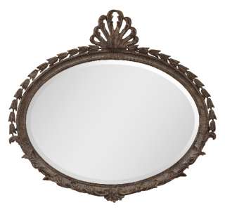 this decorative framed wall mirror features a heavily antiqued gold 