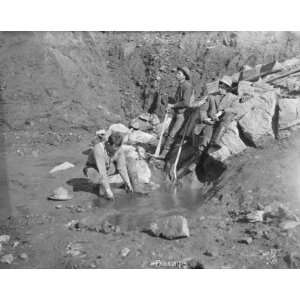  Men panning gold